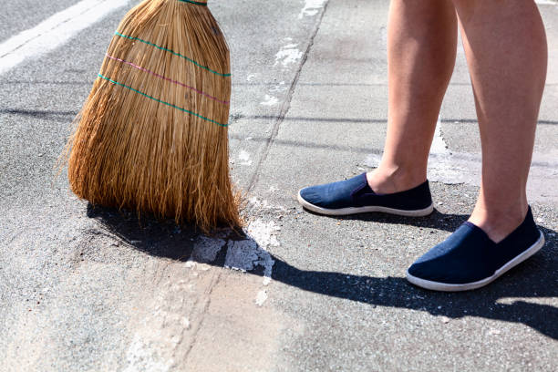 Exterior Cleaning with Corn Broom stock photo