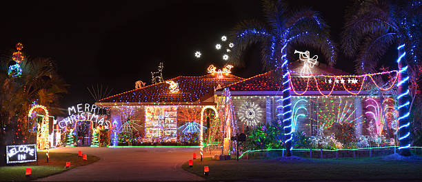 Exterior evening shot of Christmas decorated house in Southern Hemisphere Evening shot of Christmas decorated house the Southern Hemisphere christmas lights house stock pictures, royalty-free photos & images