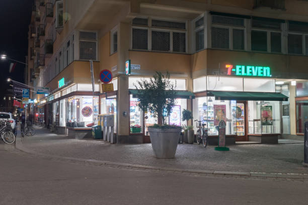 Exterior of 7-Eleven shop. 7-Eleven (7-11) shop at night. Stockholm, Sweden - September 24, 2019: Exterior of 7-Eleven shop. 7-Eleven (7-11) shop at night. number 711 stock pictures, royalty-free photos & images