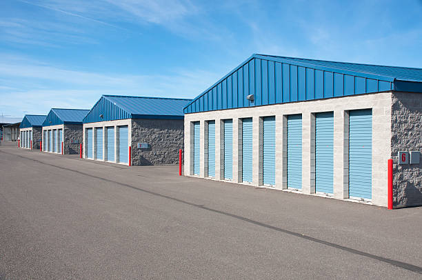 Exterior of blue and tan storage units Exterior of the storage units.  self storage stock pictures, royalty-free photos & images