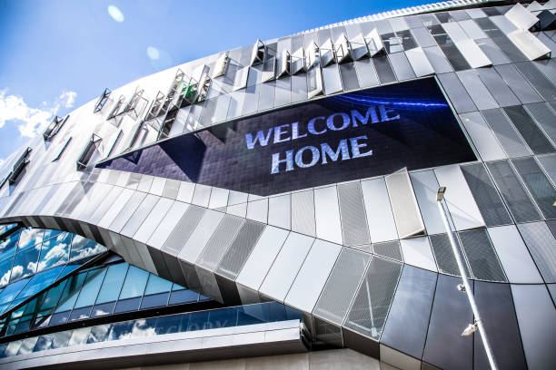 Exterior of new Tottenham Hotspur stadium in London, UK London, UK - 12 May, 2019: color image depicting the ultra modern architecture of the brand new Tottenham Hotspur football stadium in London, UK. Tottenham Hotspur Stadium is a stadium currently under construction that will serve as the home ground for Tottenham Hotspur in north London, replacing the club's previous stadium, White Hart Lane. It has a planned capacity of 62,062, making it one of the largest in the Premier League and the largest for a club stadium in London. It is designed to be a multi-purpose stadium and features a world's-first dividing, retractable football pitch, that reveals a synthetic turf pitch underneath for NFL London Games, concerts and other events. Room for copy space. Tottenham Hotspur stock pictures, royalty-free photos & images