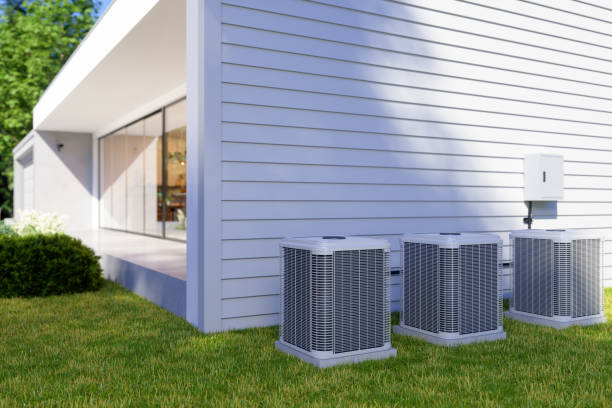 Exterior Of Villa With Air Heat Pumps In The Backyard stock photo