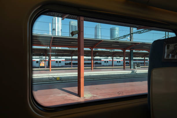 Exterior view from the window of a Renfe train, Madrid Madrid, Spain - June 2, 2021: Exterior view of skyscrapers from the window of a Renfe Avant mid-distance train, at the Chamartin train station public service stock pictures, royalty-free photos & images