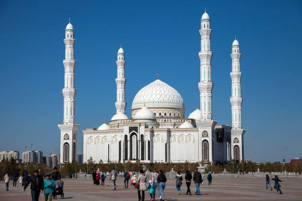 Exterior view The Hazrat Sultan Mosque in Astana capital of Kazakhstan Exterior view The Hazrat Sultan Mosque in Astana capital of Kazakhstan.People walking in independence square.Nur Sultan,Kazakhstan.1 May 2017 central asia stock pictures, royalty-free photos & images