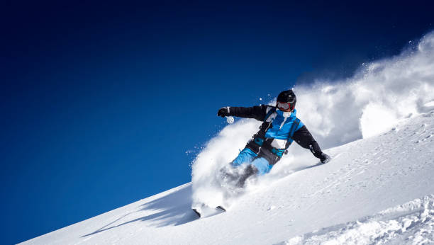 extreme skier in powder snow Expert skier showing skills powder mountain stock pictures, royalty-free photos & images