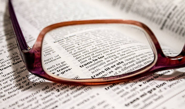 eyeglasses on the dictionary stock photo