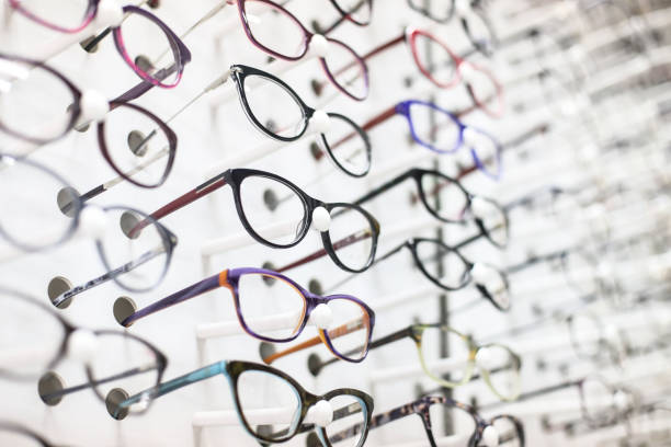 Eyeglasses Large group of eyeglasses in an eyewear store display. optical instrument stock pictures, royalty-free photos & images