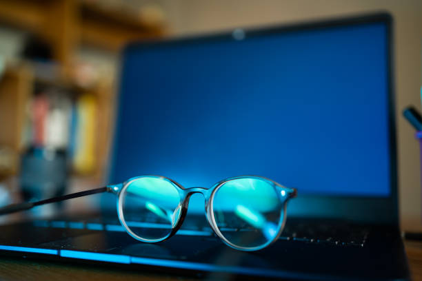 Eyeglasses with blue light filter can protect your eyes from screens. stock photo