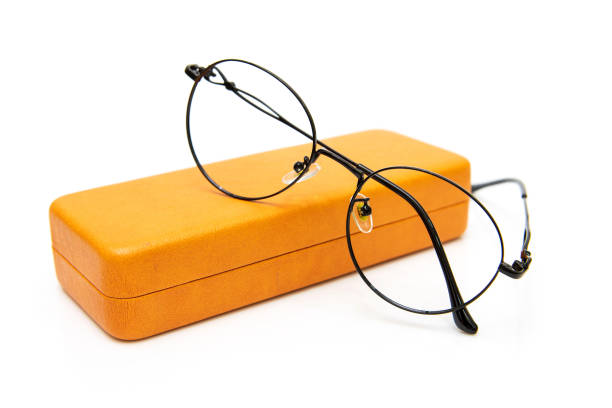 Eyeglasses with orange glasses case isolated on white background. stock photo