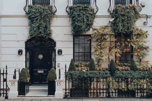 Facade of greenery covered traditional house in Mayfair, London, UK. stock photo