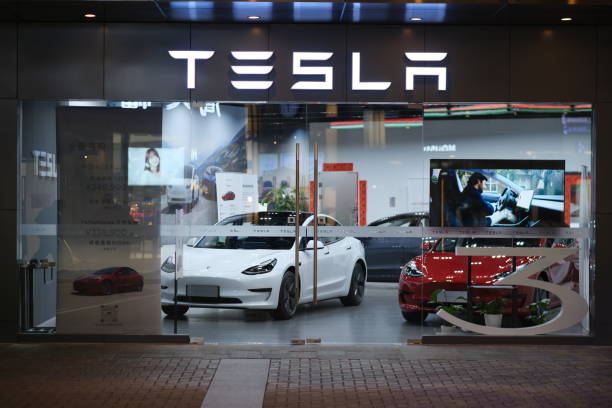 facade of Tesla store at night in China Shanghai.China-Feb.2021: facade of Tesla store at night. American electric car brand tesla motors stock pictures, royalty-free photos & images