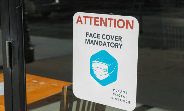 Face cover mandatory attention sign stock photo