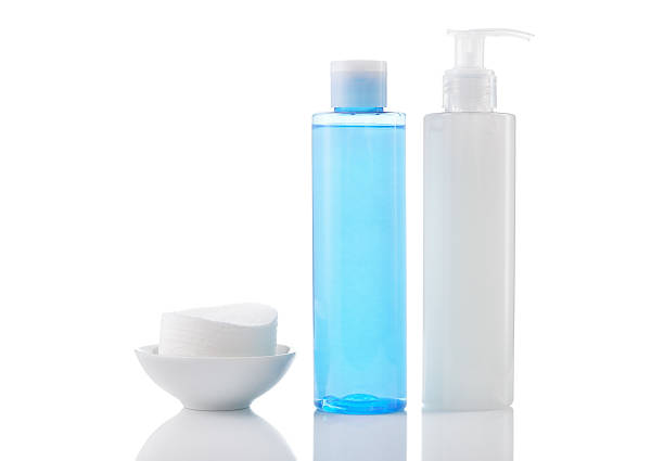 Face wash cleansing gel, toner and cotton cleansing pads isolate stock photo