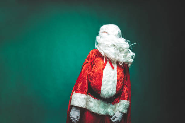 Faceless Santa Claus portrait studio shot Faceless Santa Claus studio shot background with copy space. Secret Santa ad banner happy Christmas Holidays concept, Santa Clause hiding face portrait covered with white hair and beard with negative space. blank expression photos stock pictures, royalty-free photos & images