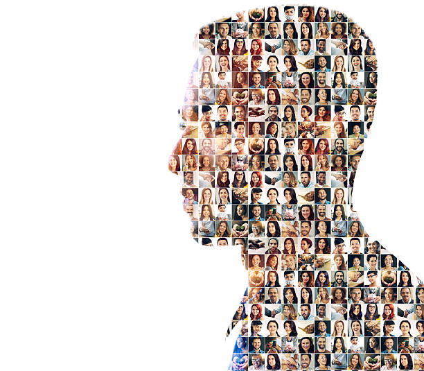 Faces of mankind Composite image of a diverse group of people superimposed on a man's profile crowd of people photos stock pictures, royalty-free photos & images
