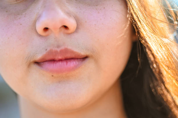 Facial hair on woman mouth and lips stock photo