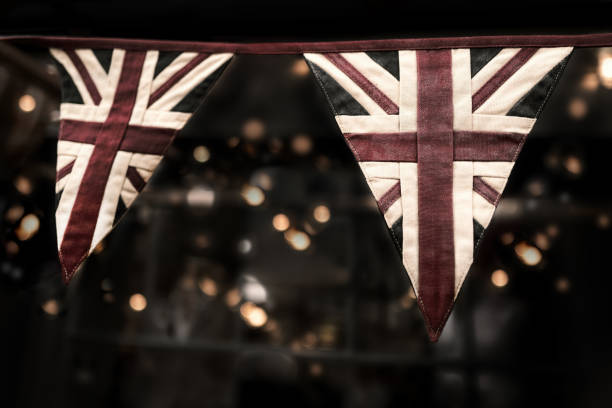 Faded vintage Union Jack bunting with bokeh background. Ideal for platinum jubilee celebrations. stock photo
