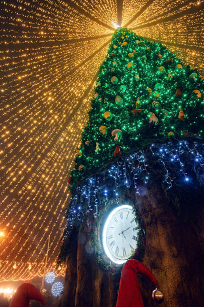 Fairy Christmas tree lights on night city square stock photo