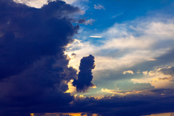 Fairy dark clouds with sunlight stock photo