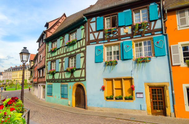 Fairytale street in Old Town of Colmar, Alsace, France Typical architecture in Alsace in Eastern France colmar stock pictures, royalty-free photos & images