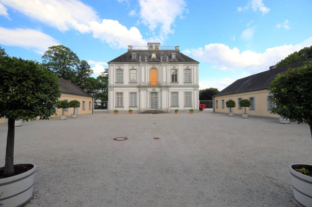 Falkenlust hunting lodge. Brühl, Germany, Europe. Brühl, Germany – June 12, 2020: Visiting the Baroque Falkenlust hunting lodge on an evening in June. bruehl stock pictures, royalty-free photos & images