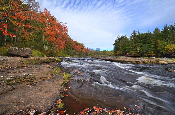 Fall Colors Along the Kettle River Fall Colors Along the Kettle River in Banning State Park near Sandstone, Minnesota state park stock pictures, royalty-free photos & images
