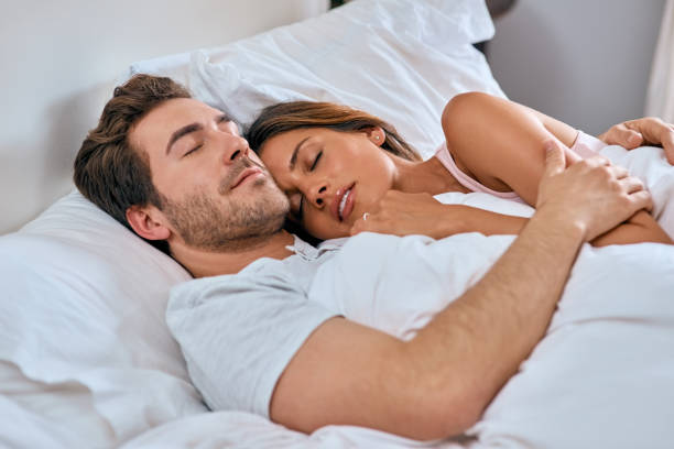Young Couple Lying On The Bed Stock Photos, Pictures & Royalty-Free ...