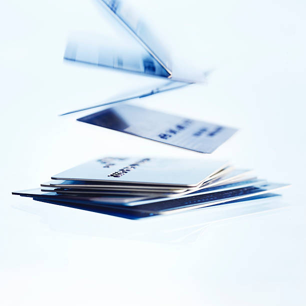 Falling credit cards stock photo