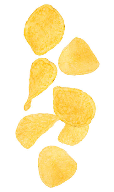 Falling potato chips isolated on white background stock photo