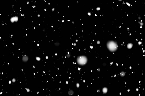 Falling snow on black background. stock photo