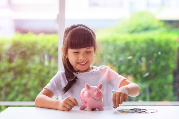 Family 79 a little girl try to saving money for future, learning to save budget for future allowance stock pictures, royalty-free photos & images
