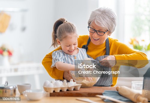 istock family are preparing bakery together 1304197615