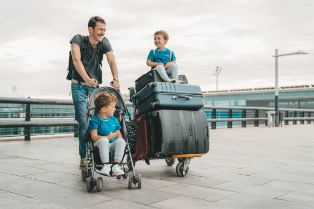Family at the airport Family at the airport luggage cart stock pictures, royalty-free photos & images