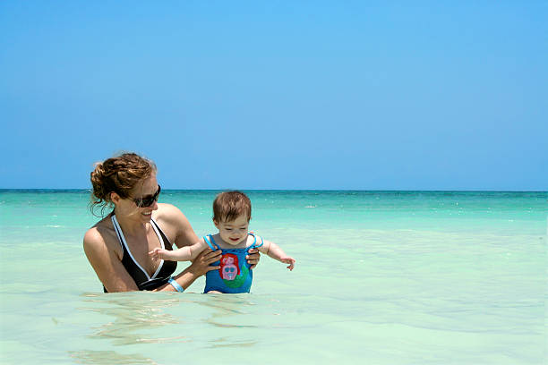 Family Beach Fun  puerto rican women stock pictures, royalty-free photos & images