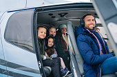 istock Family going on a helicopter ride 1341275432
