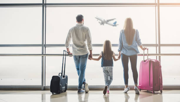 Family in airport Family in airport. Attractive young woman, handsome man and their cute little daughter are ready for traveling! Happy family concept. airport stock pictures, royalty-free photos & images