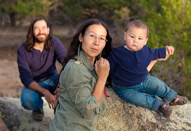 Family in nature Young multicultural family in nature - shallow DOF - focus on mother & baby indigenous peoples of the americas stock pictures, royalty-free photos & images