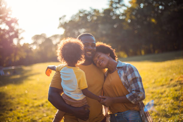 Family love. African American family in nature. stock photo