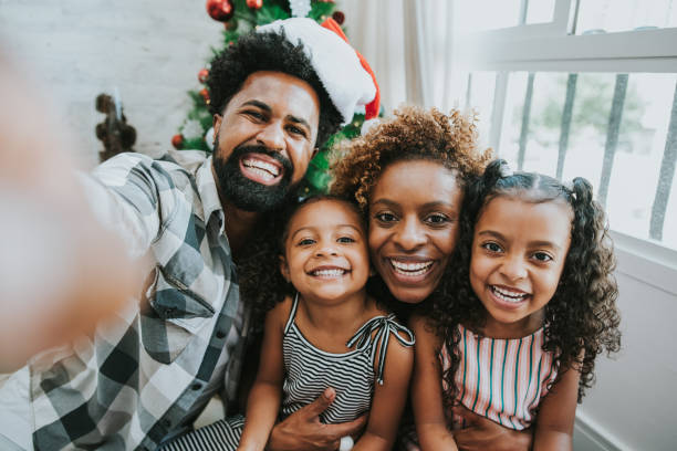 Family making selfie smiling and celebrating Christmas at home Family making selfie smiling and celebrating Christmas at home brazil photos stock pictures, royalty-free photos & images
