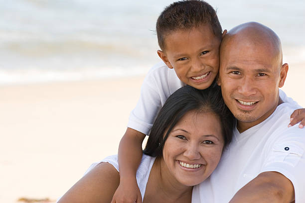 Family Asian family at the beach filipino family stock pictures, royalty-free photos & images