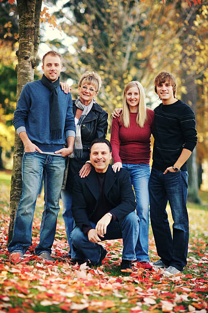 Family Portrait in Cool Fall Park stock photo