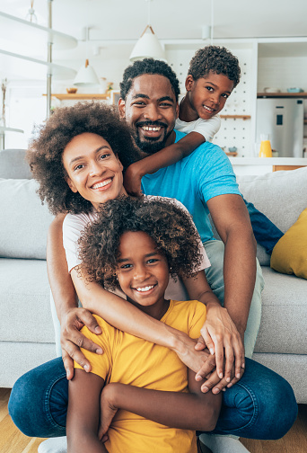 Portrait of african ethnicity family, happy together at home