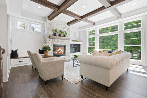 Hardwood flooring and wood beams on the coffered ceiling
