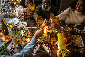 istock Family toasting on Christmas dinner at home 1345495900