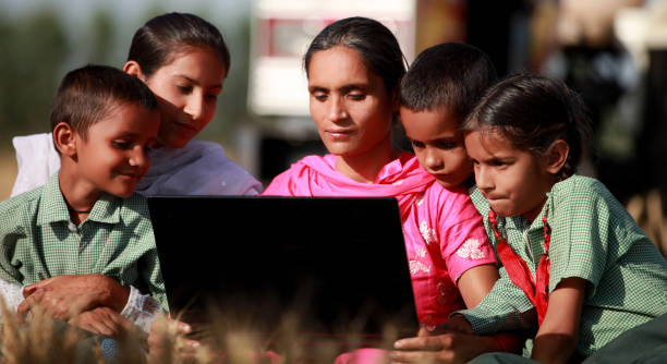 Family using laptop together outdoor in nature Family using laptop together outdoor in nature. developing countries stock pictures, royalty-free photos & images