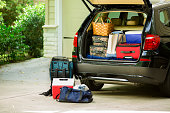 istock Family vehicle packed, ready for road trip, vacation outside home. 510689315