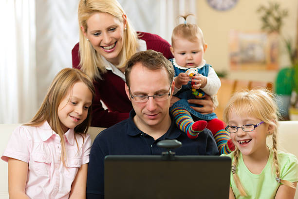 Family with computer having video conference