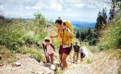 istock Family with small children hiking outdoors in summer nature, walking in High Tatras. 1305177948