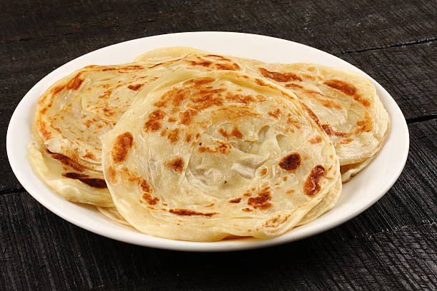 Famous Asian flat bread known as Parathas, Famous Asian flat bread known as Parathas,served in plate. chapatti stock pictures, royalty-free photos & images