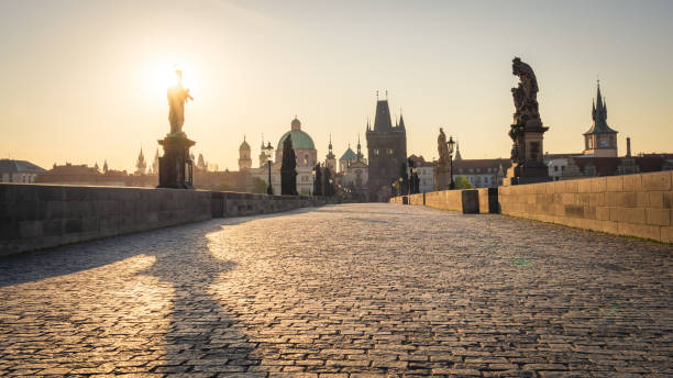 Famous Charles Bridge in Prague. Scenic view of baroque statues and the Old Town in the morning. No people on the bridge due to Covid-19 outbreak in April 2020 Famous Charles Bridge in Prague. Scenic view of baroque statues and the Old Town in the morning. No people on the bridge due to Covid-19 outbreak in April 2020 charles bridge stock pictures, royalty-free photos & images